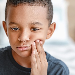 Closeup of child experiencing toothache