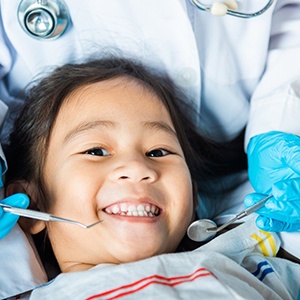 Little girl smiling about to have dental exam