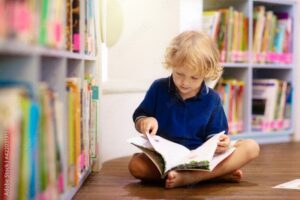 Child reading book.
